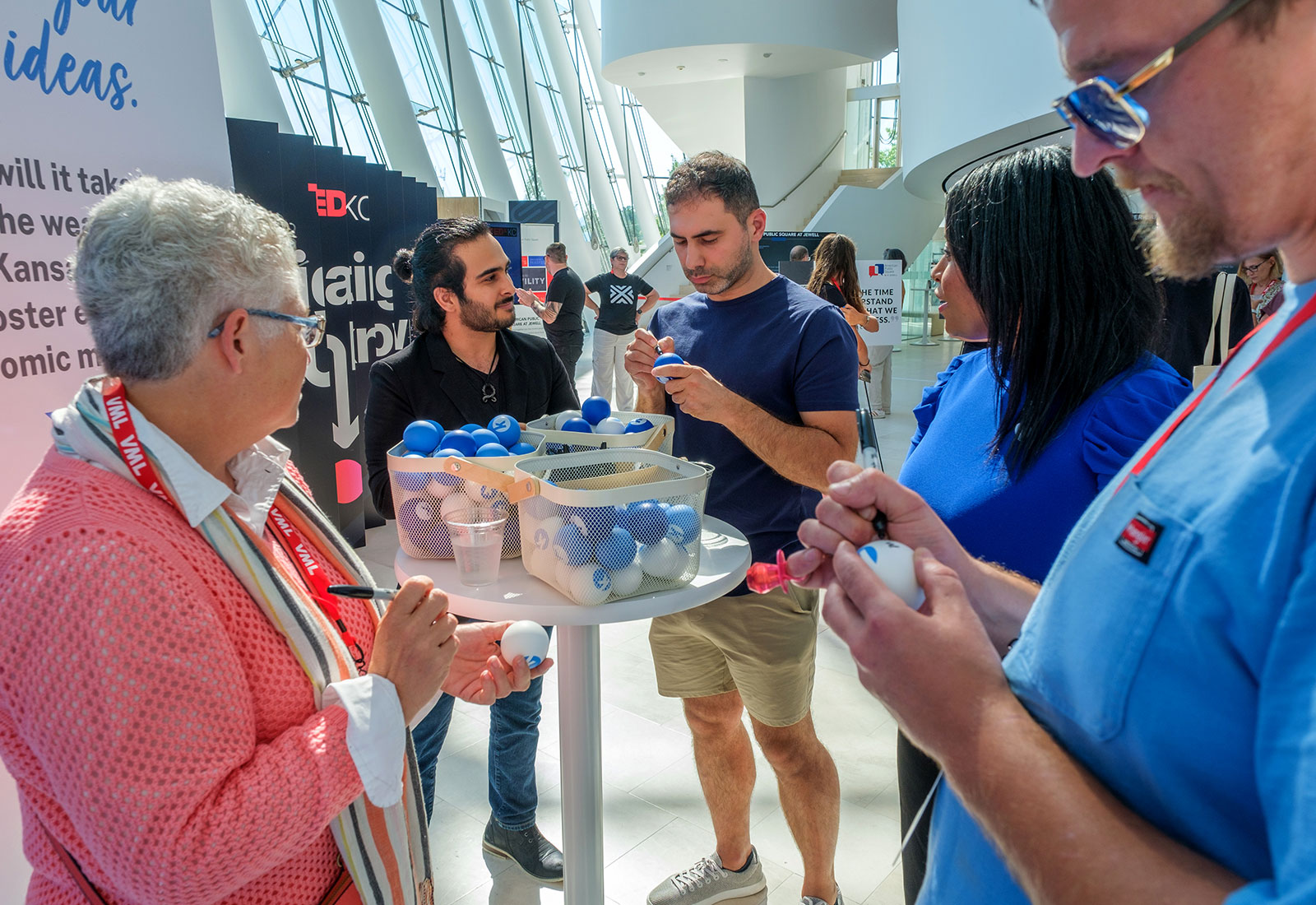 TEDxKC 2024 attendees share their big ideas at the Kauffman Foundation heart installation at the Kauffman Center for Performing Arts