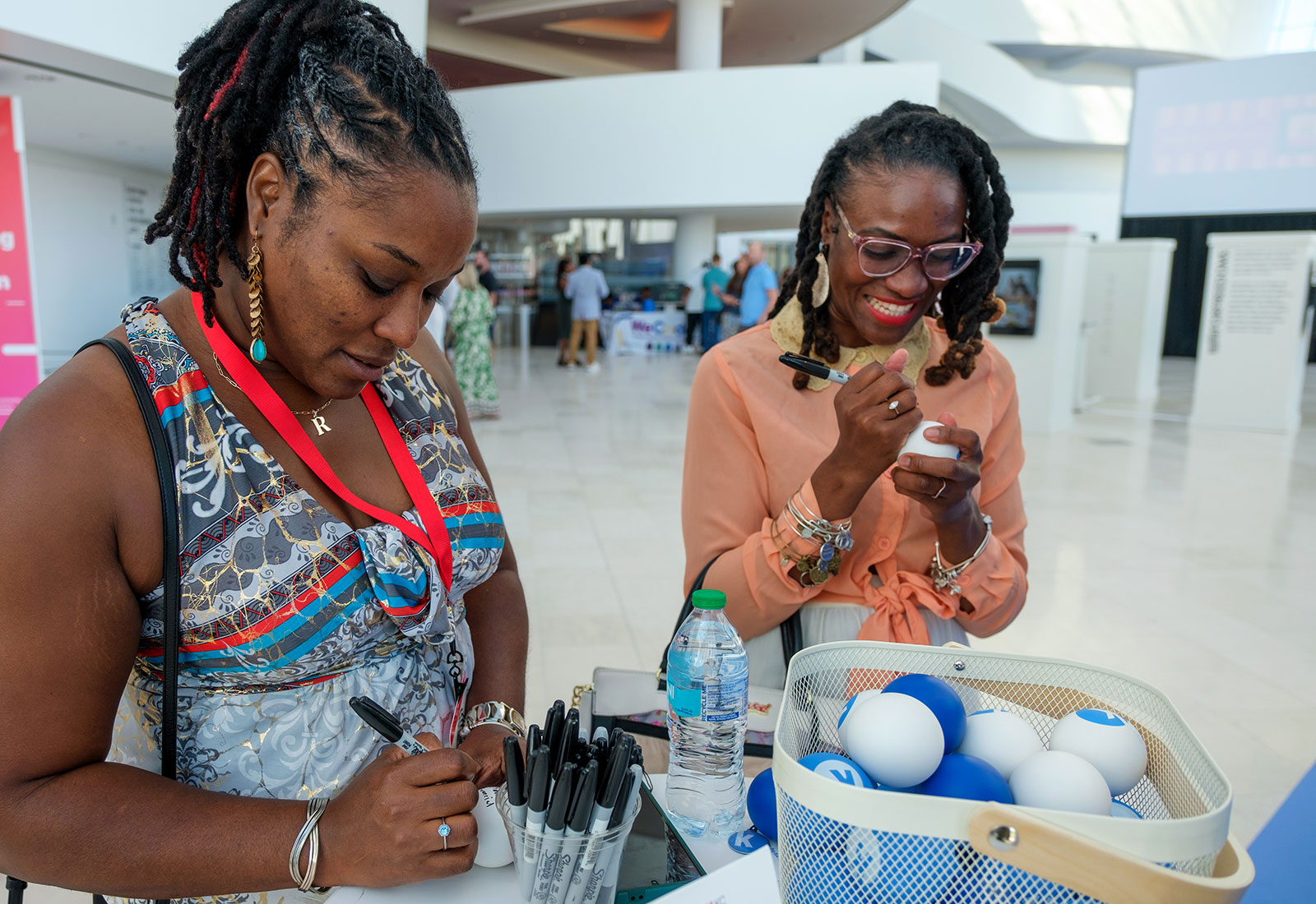 TEDxKC 2024 attendees share their big ideas at the Kauffman Foundation heart installation at the Kauffman Center for Performing Arts