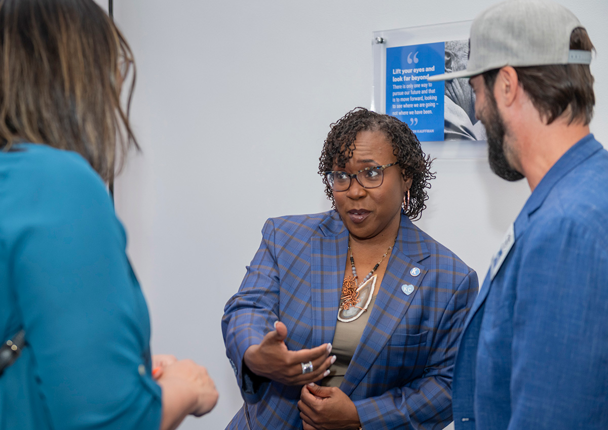 Dr. DeAngela Burns-Wallace greets community members at the Ewing Marion Kauffman Foundation Spark Open House event