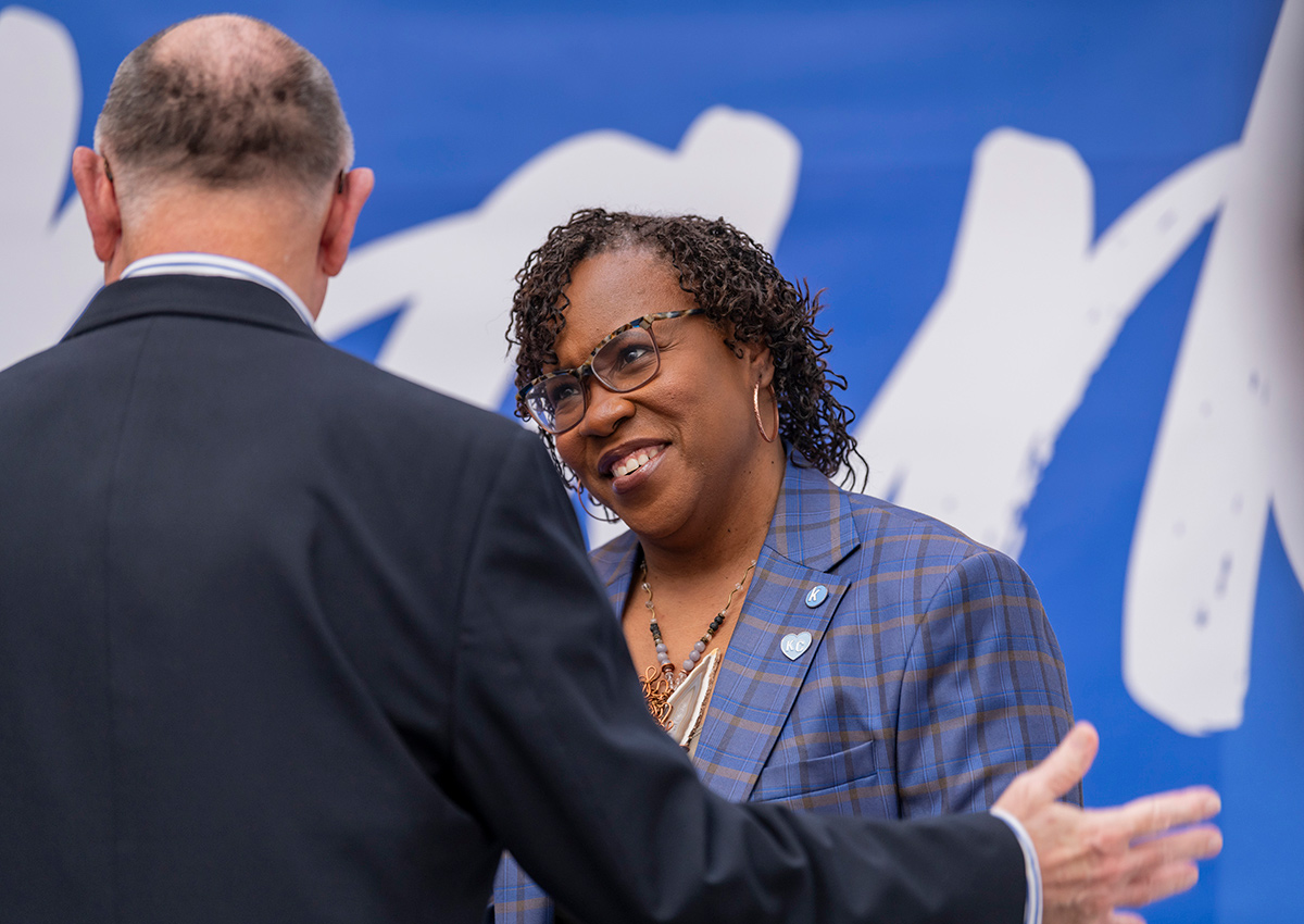 Dr. DeAngela Burns-Wallace greets a community member at the Ewing Marion Kauffman Foundation Spark Open House event